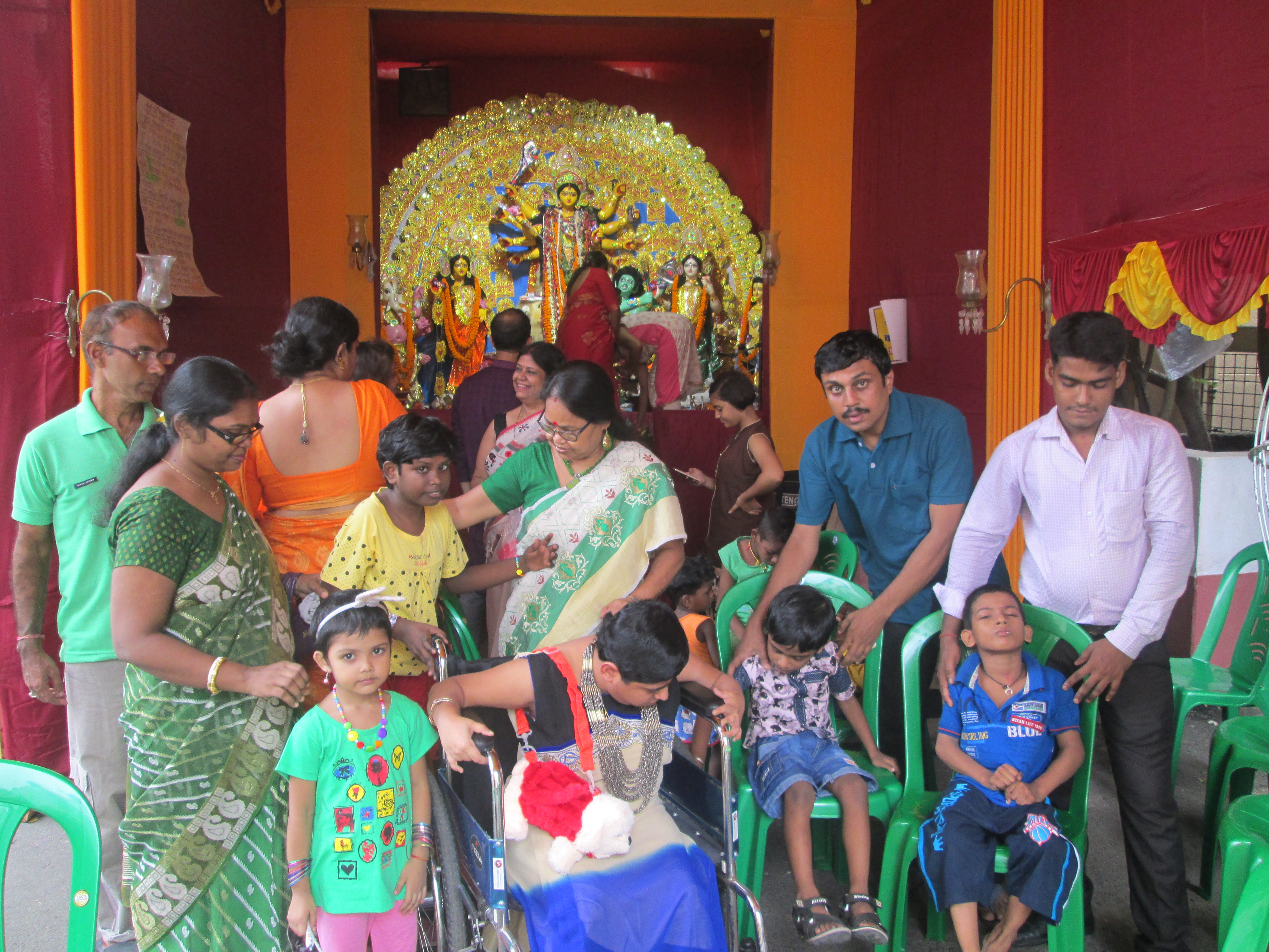 Saurav Ganguly distributing educational materials to students